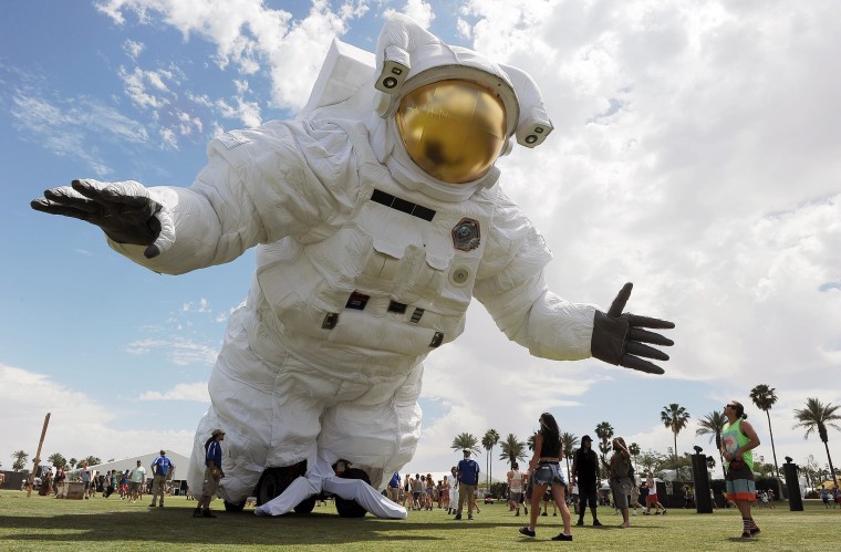 Image: The \"Escape Velocity\" moving sculpture by artist group Poetic Kinetics looms over Coachella festival-goers on the Empire Polo Field