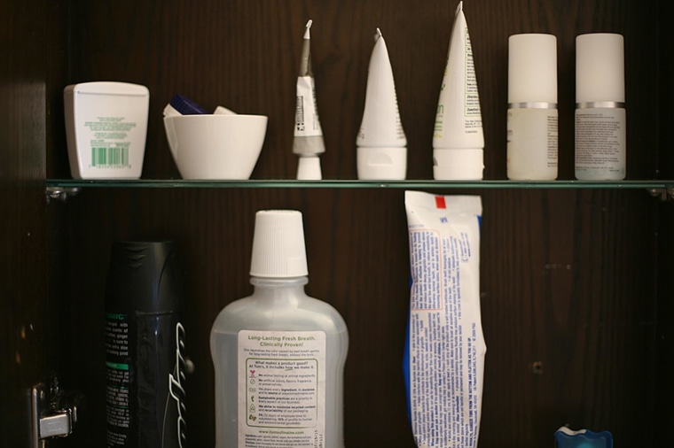 Lotions and other items are displayed in a medicine cabinet