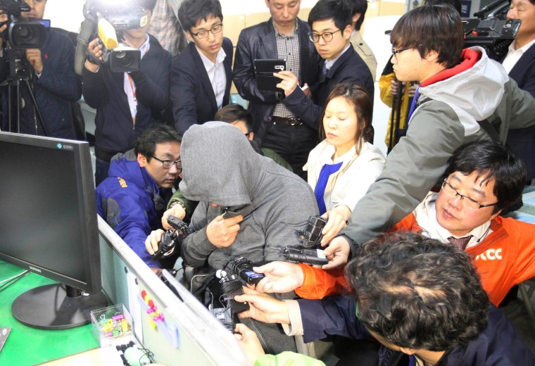 Image: The captain of the South Korean ferry Sewol, which sank at sea off Jindo, is investigated at Mokpo police station