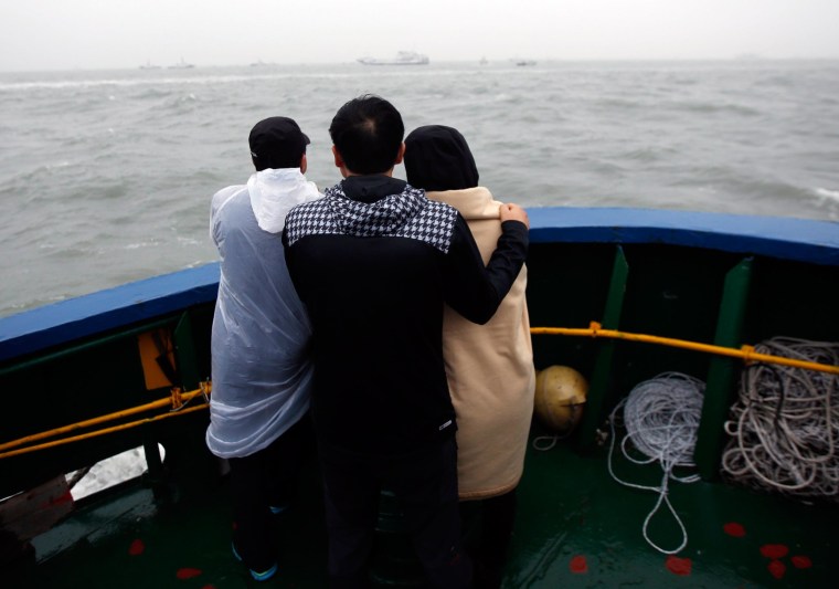 Image: Family members of missing ferry passengers