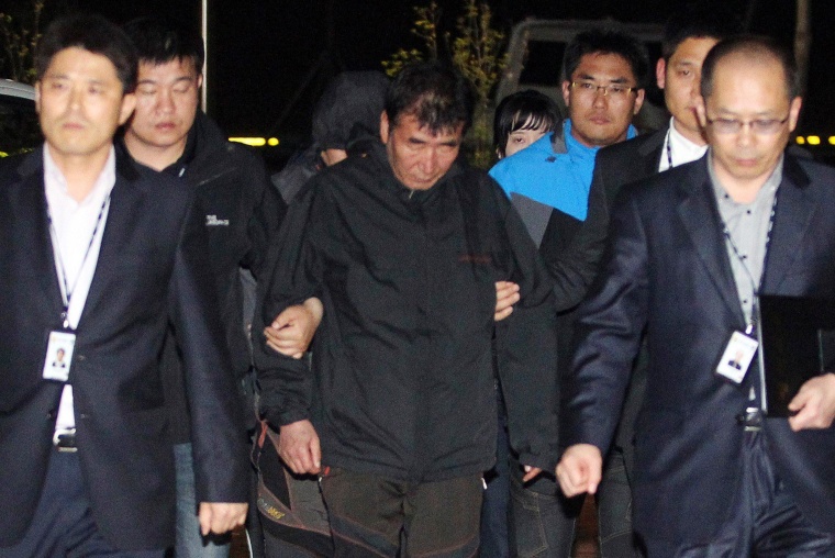 Image: Lee Joon-Seok, captain of the South Korean ferry Sewol which capsized on Wednesday, arrives at a court in Mokpo