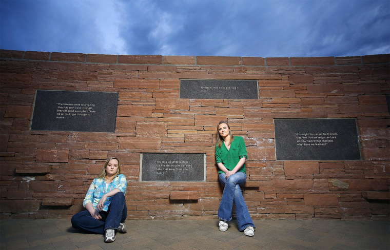 Image: Former Columbine High School students Jennifer Hammer, left, and Heather Egeland pose for a portrait at the Columbine Memorial