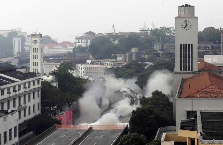 Image: Explosives are detonated to demolish part of the Perimetral overpass, as part of Rio's Porto Maravilha urbanisation project, in Rio de Janeiro