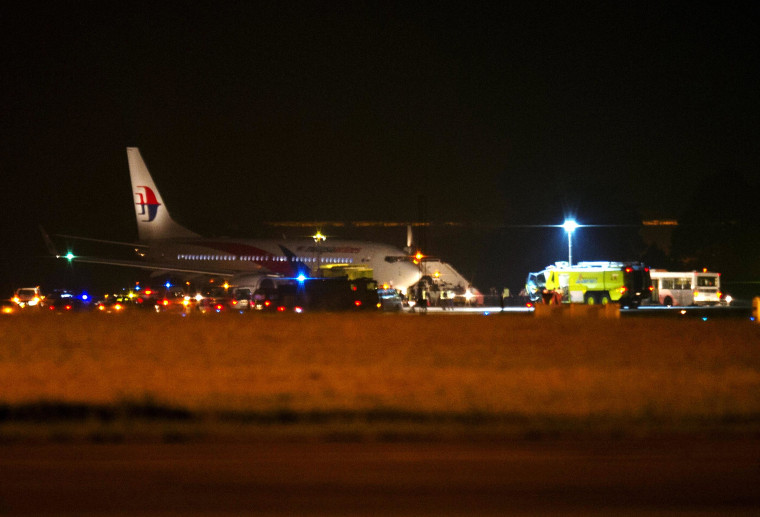 Image: Malaysia Airline flight MH192 is seen on the tarmac after an emergency landing at the Sepang International Airport, outside Kuala Lumpur