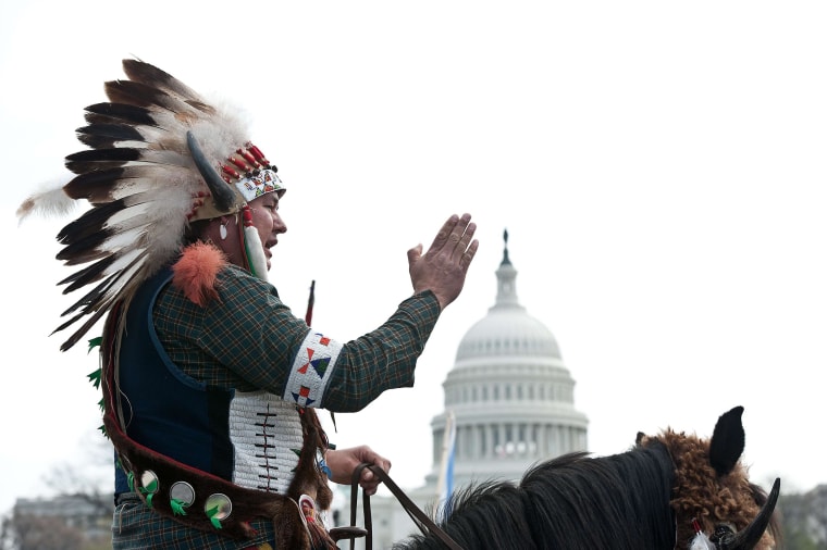 Image: A Native American tribal leader sits on his horse in front of the U.S. Capitol in Washington as the Cowboy and Indian Alliance protest the proposed Keystone XL pipeline