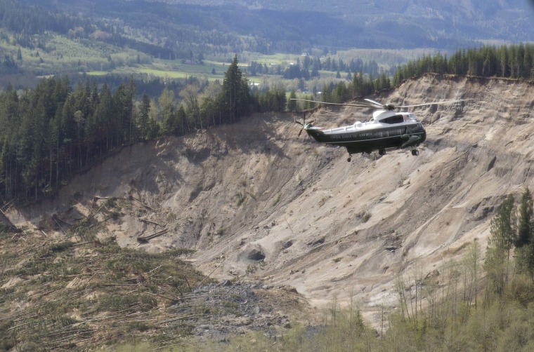 Image: Marine One, carrying U.S. President Barack Obama, takes an aerial tour of Oso, Wash.