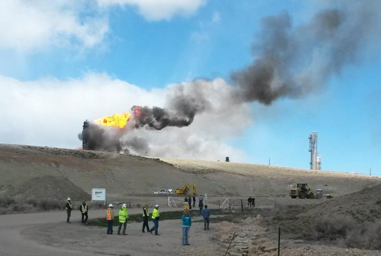 Image: A fire burns after an explosion at a natural gas pipeline hub in Opal, Wyo., on Wednesday, April 23, 2014.
