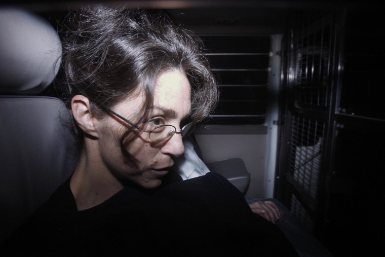 Image: Nancy Kissel, dubbed the "milkshake" murderess, sits in a prison van as she arrives at the Court of Final Appeal in Hong Kong