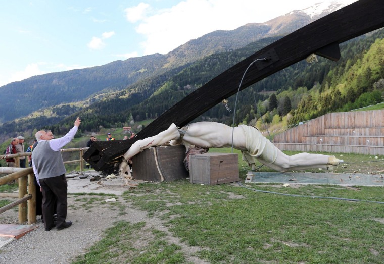 A giant crucifix dedicated to Pope John Paul II collapsed, killing a 21-year-old student, in Cevo, Italy, on April 24, 2014.
