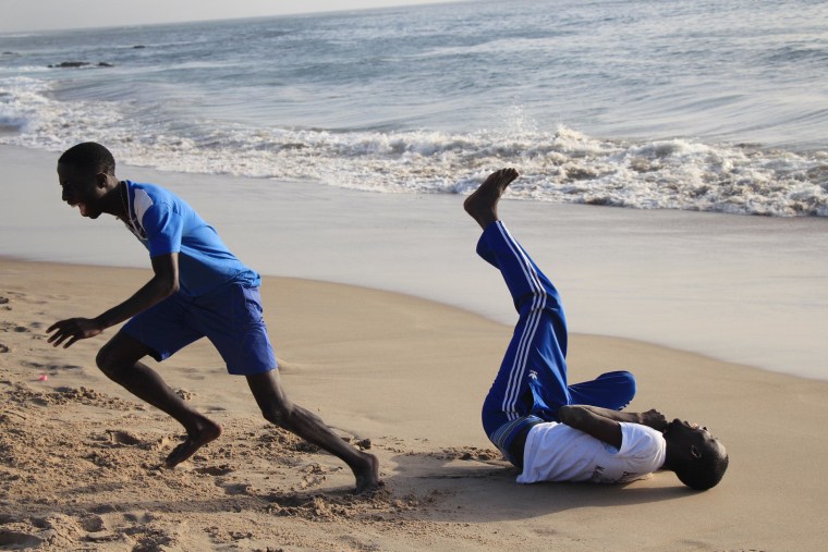 Boys play on the beach in Dakar, Senegal.