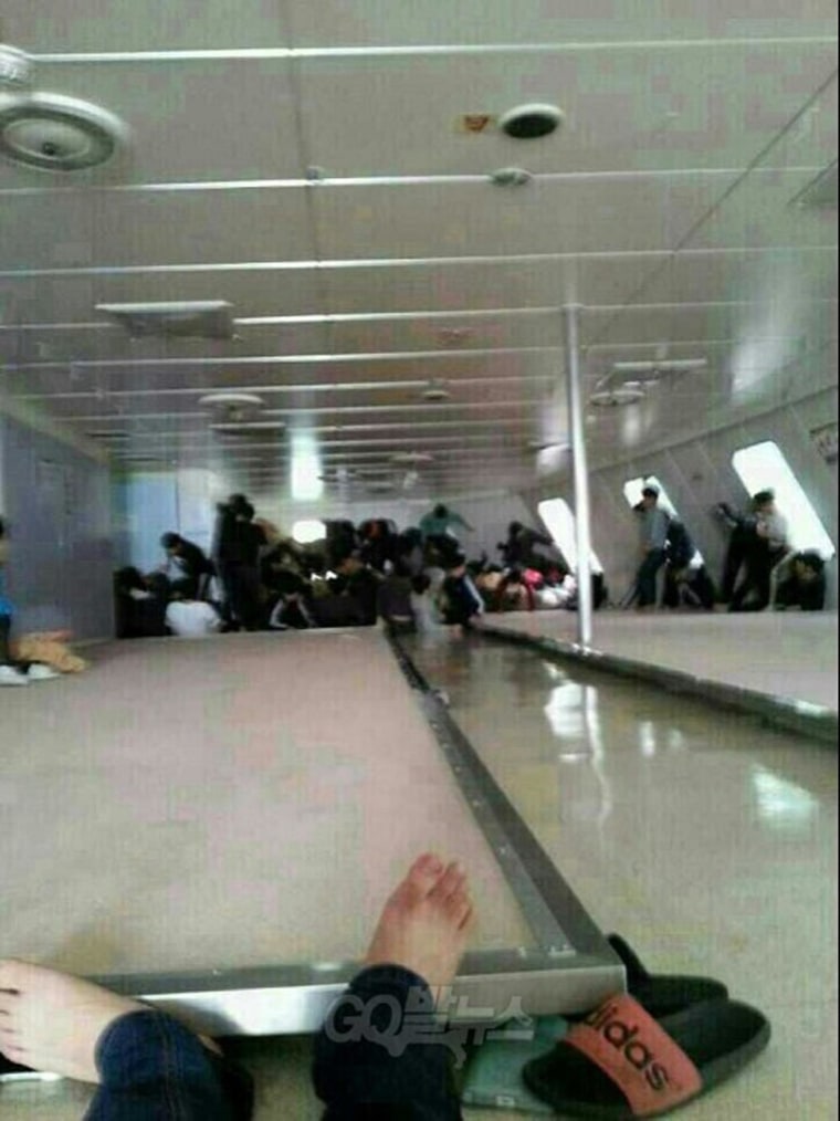 Passengers wait for rescue aboard inside the Sewol ferry as it sinks in this image posted to a social media site by a student on the ship.