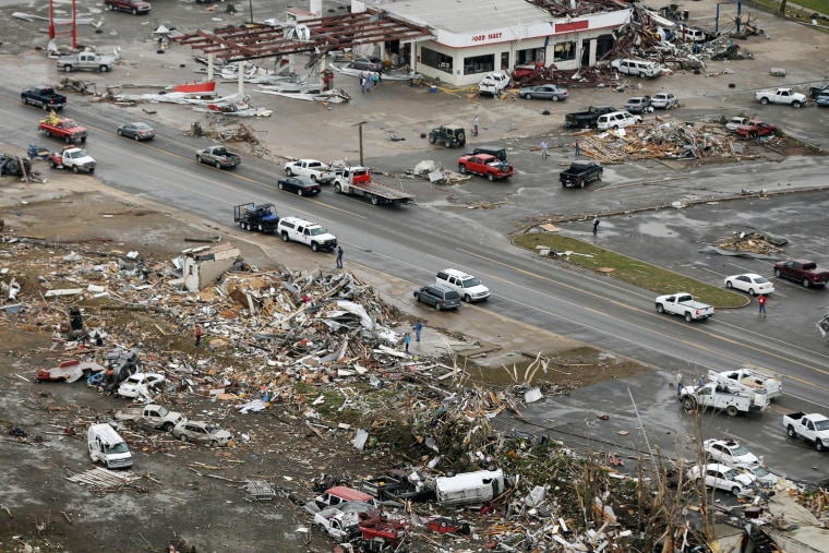 Image: Homes and businesses are wrecked in downton Vilonia, Ark.