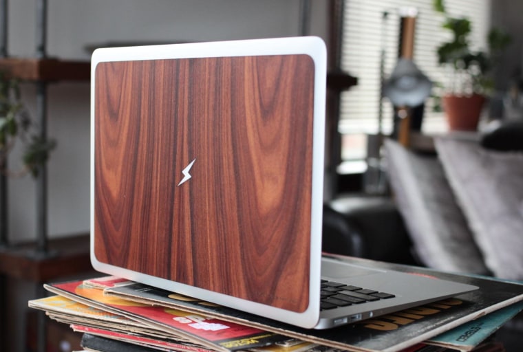 You can choose one of several symbols to be cut out and backlit on RawBKNY's laptop protector.