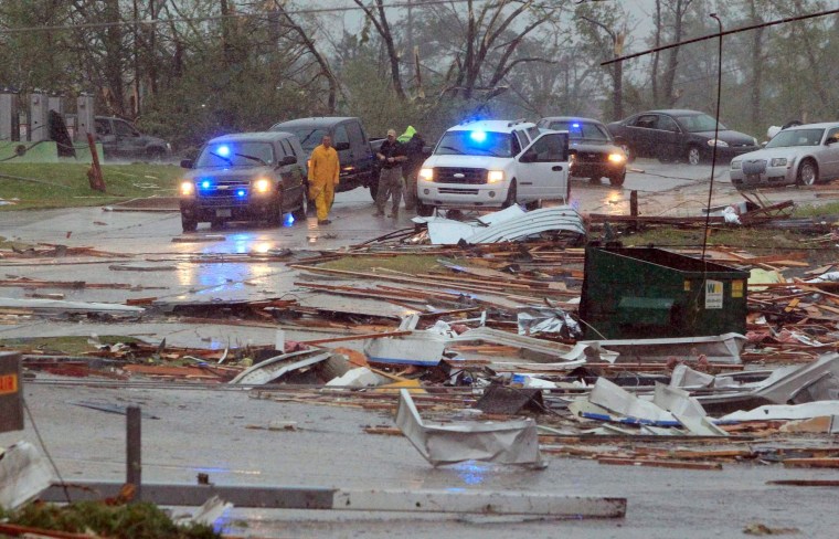 Image: First responders begin to secure areas minutes after a Tornado tore through Tupelo, Mississippi