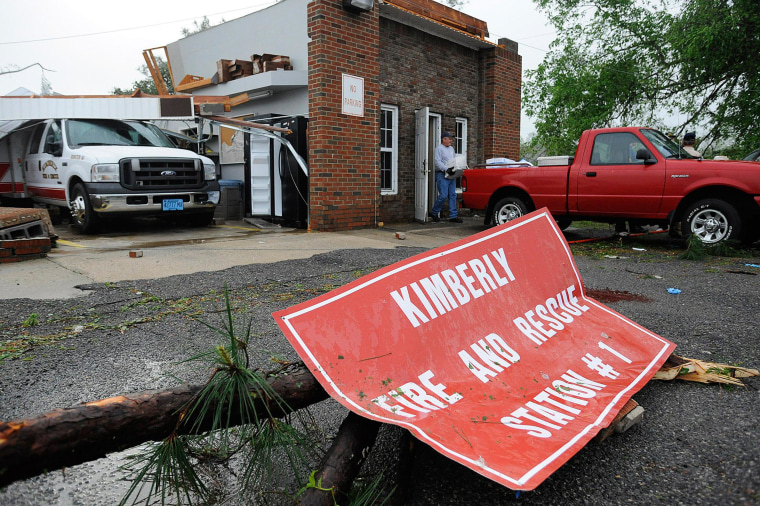Image: A worker removes items from the wrecked fire station in Kimberly, Ala., on Tuesday.