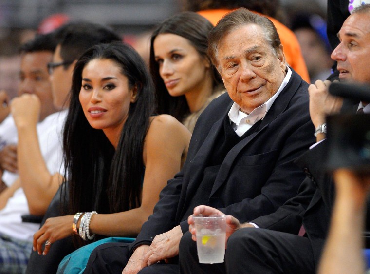 Image: Donald Sterling and V. Stiviano watch the Clippers play the Sacramento Kings 