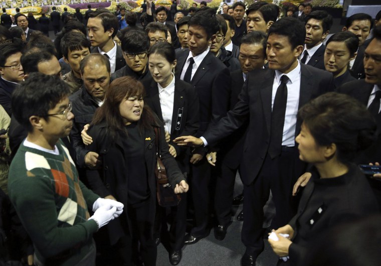 Image: South Korea's President Park meets a relative of a victim of sunken passenger ship Sewol