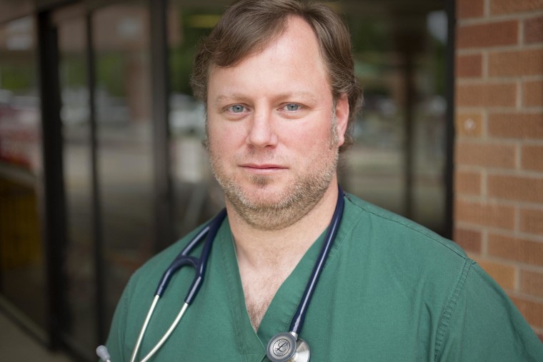 Image: Jason Skinner, an emergency room doctor at Conway Regional Medical Center, worked on Sunday night when a tornado swept through the regio