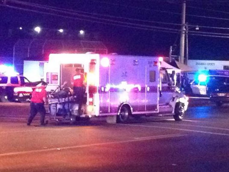 Image: A victim of an apparent explosion at the Escambia County Jail in Pensacola, Florida, is loaded into an ambulance