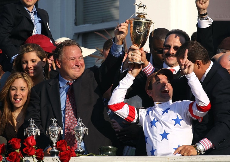  Kent Desormeaux (C), jockey for #20 Big Brown, celebrates with trainer Rick Dutrow (L of Desormeaux) after Big Brown won the 134th running of the Kentucky Derby on May 3, 2008 at Churchill Downs in Louisville, Kentucky. 