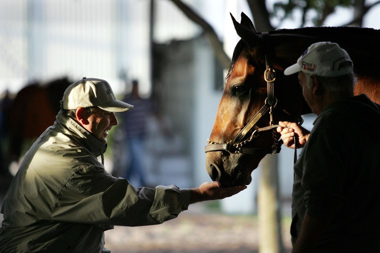 Image: Big Brown with his trainer Rick Dutrow  before he won the Kentucky Derby in 2008.