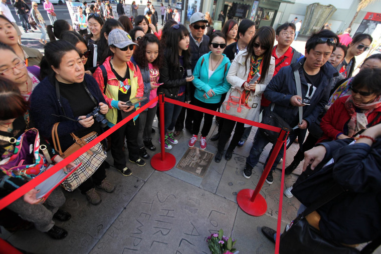 Image: Tourists take pictures in front of the TCL Chinese Theatre in Los Angeles on Feb. 11. 2014