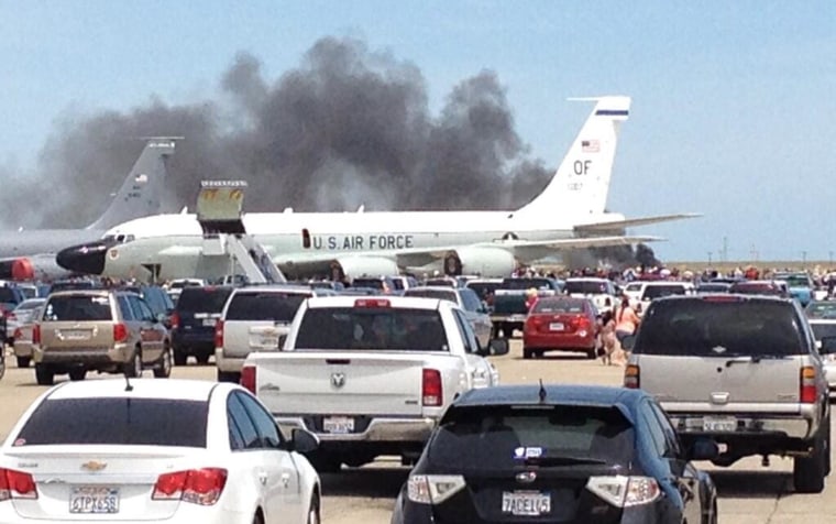 Image: Smoke billows after a plane crashed at a Travis Air Force Base air show in Fairfield, Calif., May 4, 2014.
