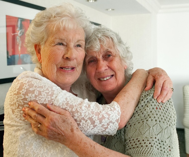 Image: Twin sisters, Ann Hunt, left, both 78, reunite for the first time since 1936,