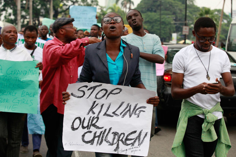 Image: People demonstrate during workers' day celebration in Lagos, Nigeria, May 1, calling on the government to rescue kidnapped schoolgirls.