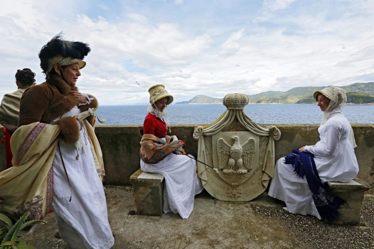 Image: People dressed in 19th century costumes re-enact the landing of French Emperor Napoleon Bonaparte