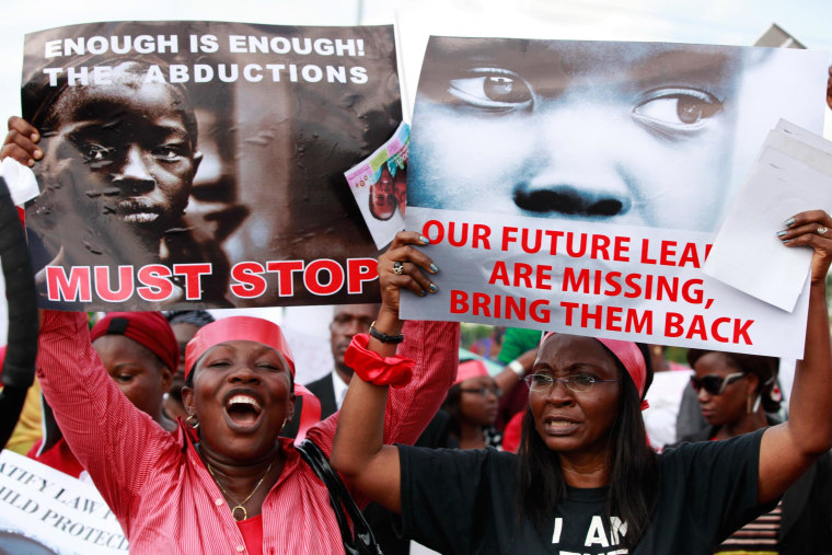 Image: Women attend a demonstration calling on government to rescue kidnapped school girls