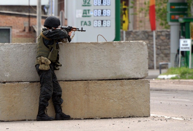 Image: Ukrainian soldier at a checkpoint near Slavyansk on Monday