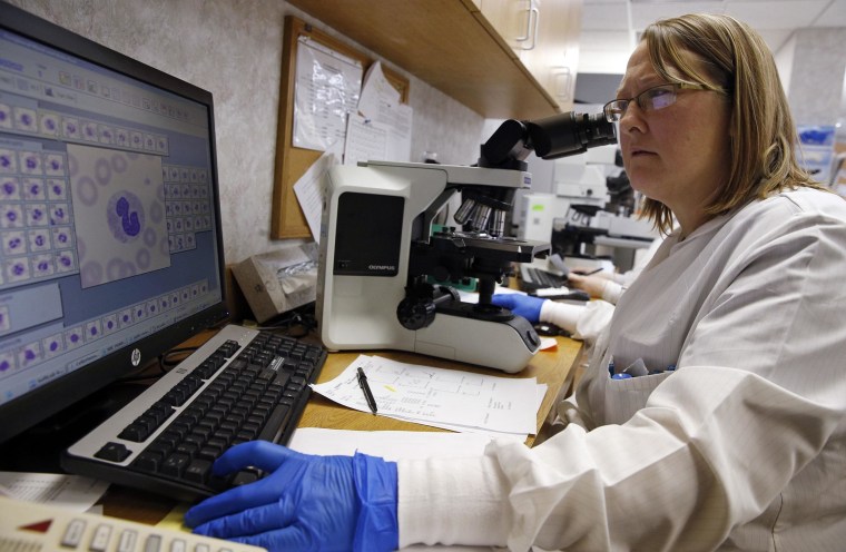 Image: Shay Wilinski works in the Microbiology Lab at Community Hospital, where a patient with the first confirmed U.S. case of Middle East Respiratory Syndrome is in isolation, in Munster, Indiana