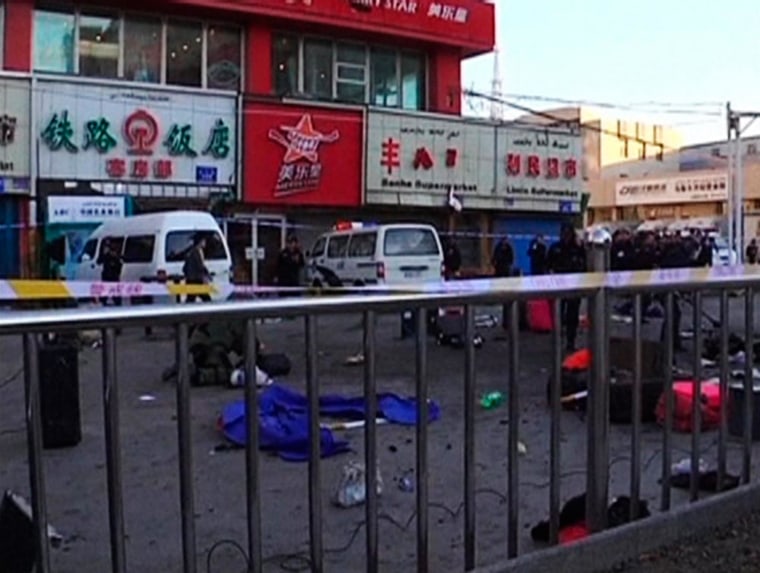 Image: The site of a bomb blast after a bomb and knife attack occurred at South Railway Station, in Urumqi