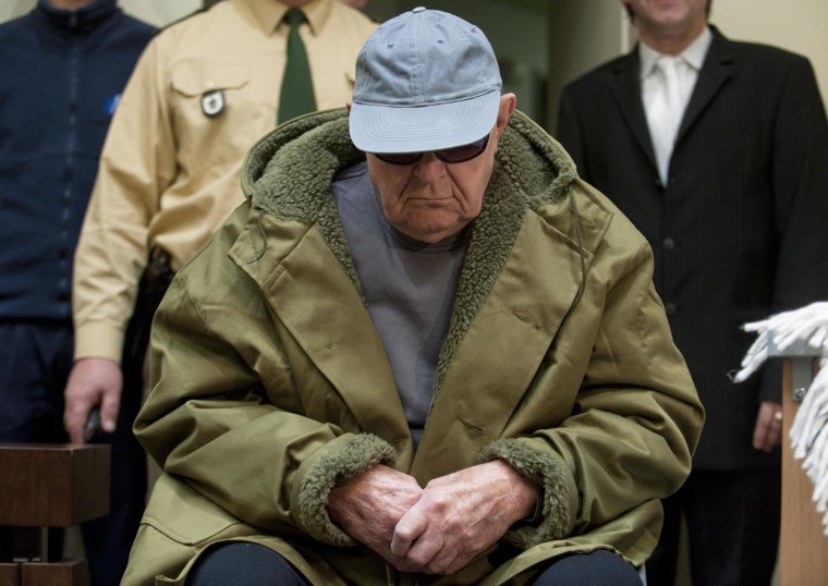 Image: John Demjanjuk arrives in a courtroom in Munich, Germany on March 22, 2011