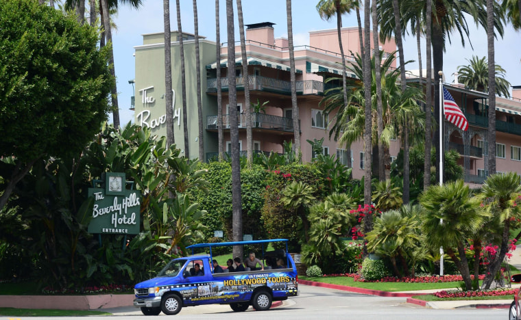 Image: A tour bus carrying passengers passes the Beverly Hills Hotel, owned by the Sultan of Brunei, on May 7, 2014, in Beverly Hills.