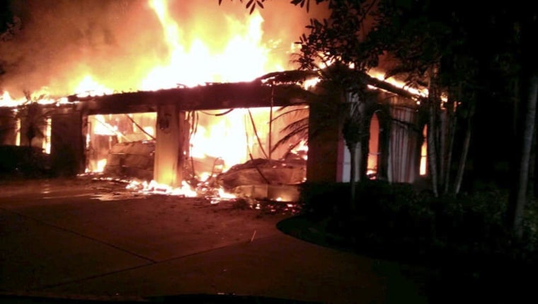 Image: Flames engulf a house owned by former tennis pro James Blake