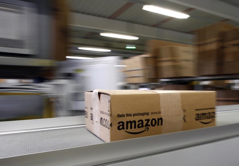 Image: A parcel moves on the conveyor belt at Amazon's logistics center