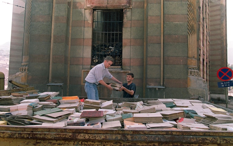 Image: Sarajevo residents try to save books in 1992