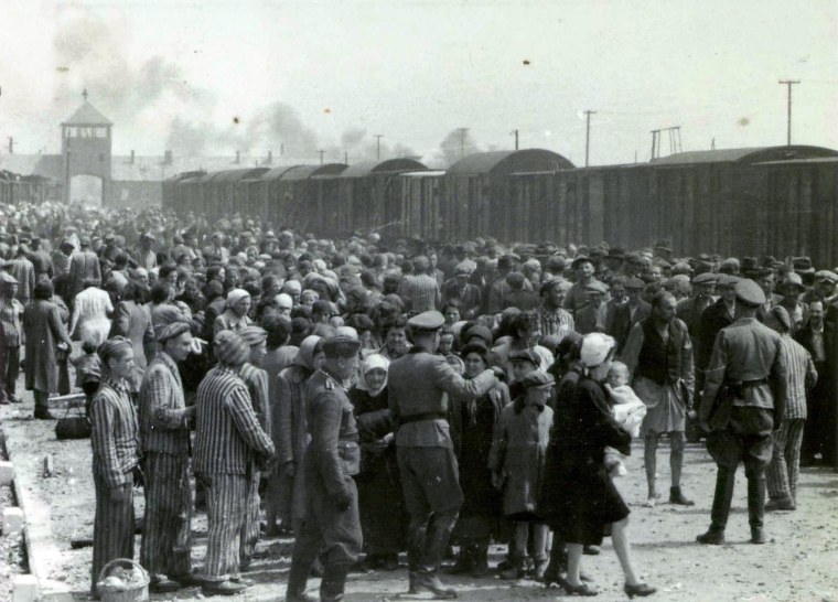 Image:  A train carrying Jews arrives at Auschwitz in May 1944 