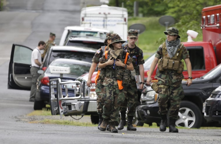 Image: Search teams arrives at a command post for the recovery efforts from a hot air balloon accident in Ruther Glen, Va., on May 10, 2014.