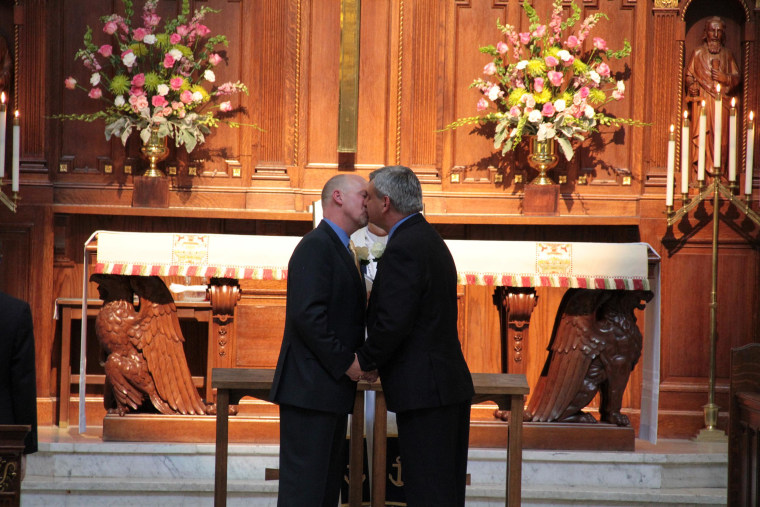 David Bucher, 49, and Bruce Moats, 50, of Maryland kiss at their wedding in Annapolis.