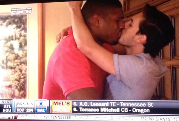 Image: Michael Sam kisses his boyfriend in celebration after finding out he has been drafted by the St. Louis Rams
