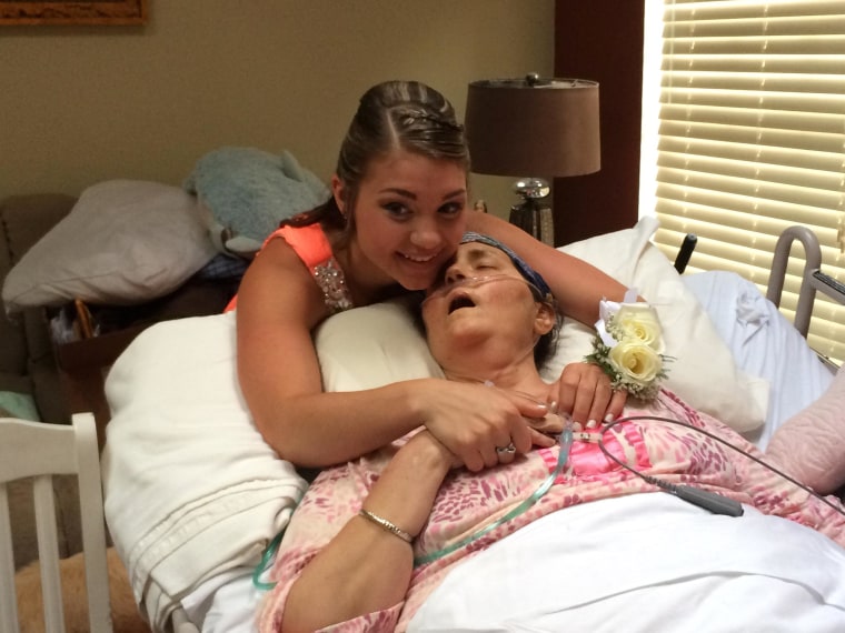Image: Megan Sugg hugs her cancer-stricken mother, Darlene Sugg on Friday before her prom.