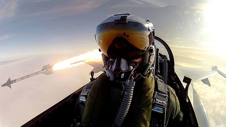 Royal Danish Air Force pilot Thomas Kristensen fires an AIM-9L air-to-air missile from his F-16 Fighting Falcon.