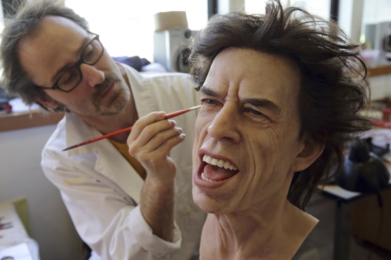 Image: Grevin Wax Museum painter Bruneau works on the head of Rolling Stones lead singer Mick Jagger at their workshop in Paris