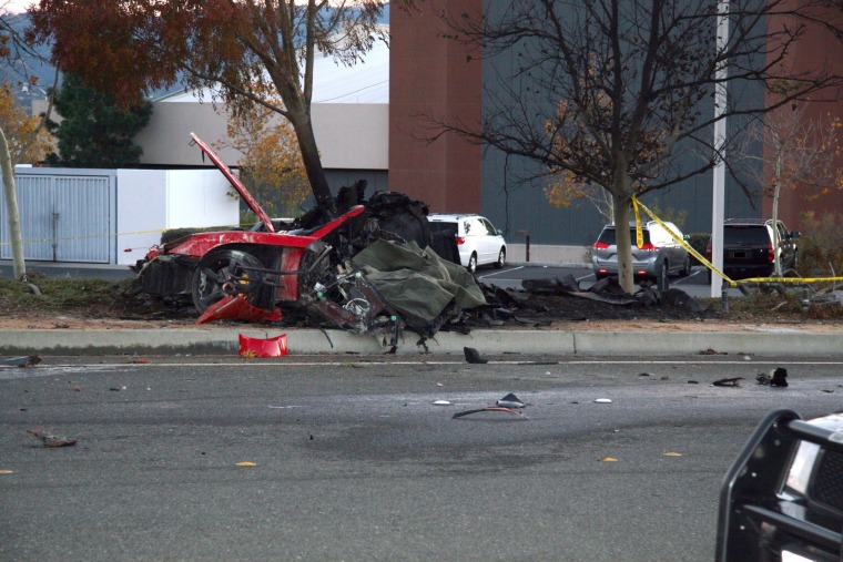 Image: The wreckage of a Porsche that crashed while carrying actor Paul Walker and driver Roger Rodas