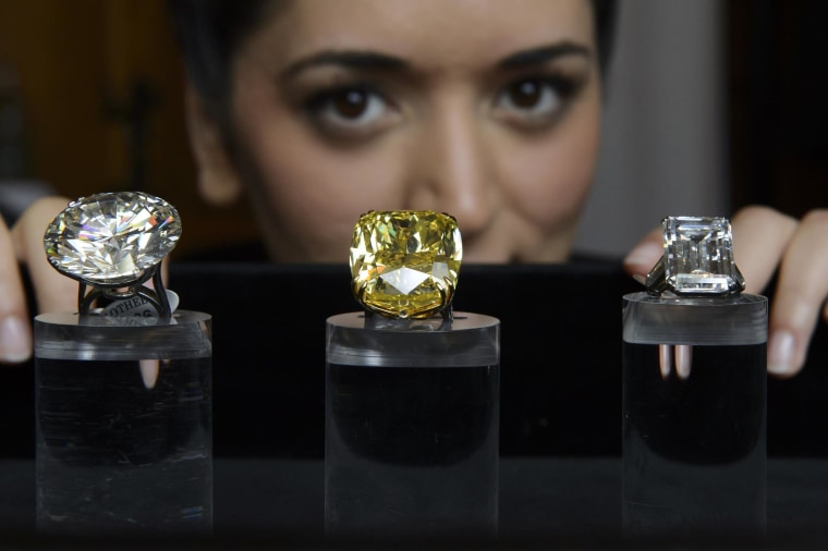 Image: Sotheby's sold a record $141.5 million in jewelry, including the highest amount ever paid for a yellow diamond.