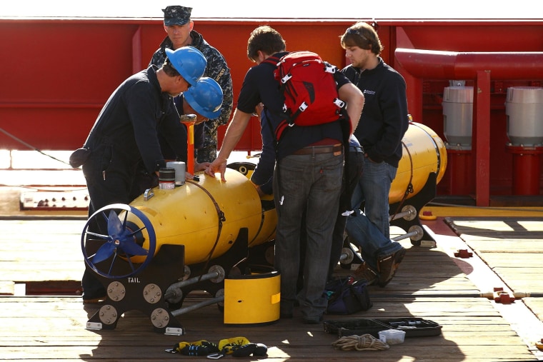 Image: Technicians work on the Bluefin-21 autonomous underwater vehicle
