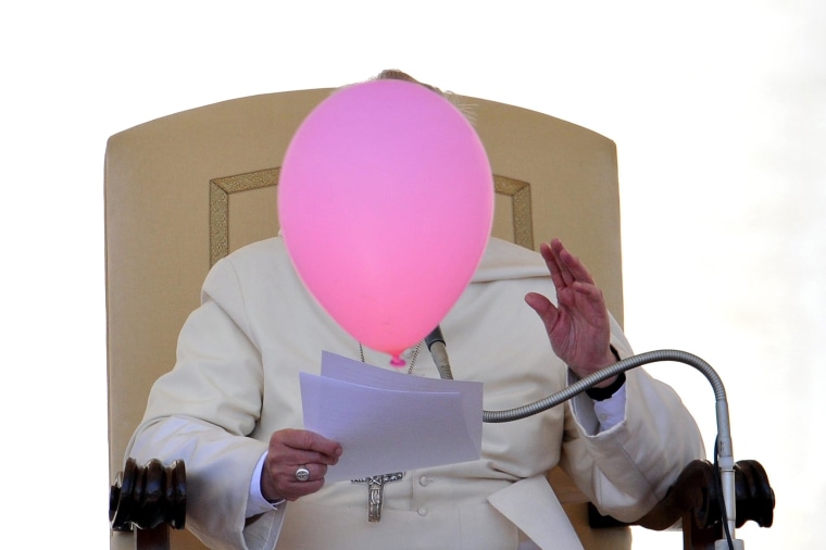 Image: A balloon flies past Pope Francis during his general audience